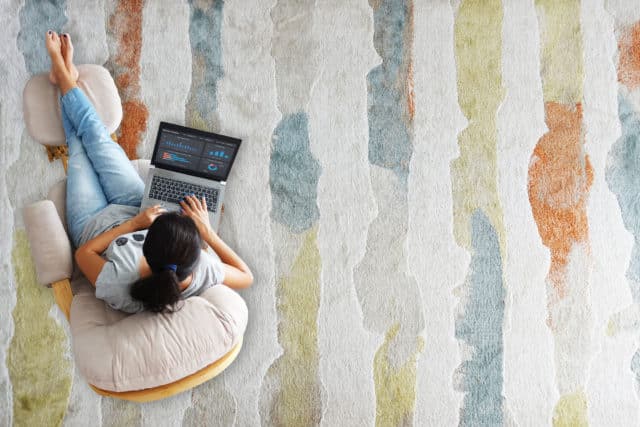 It's important to get up and move while working from home, unlike the young lady in the picture who's woking while laying on the floor.